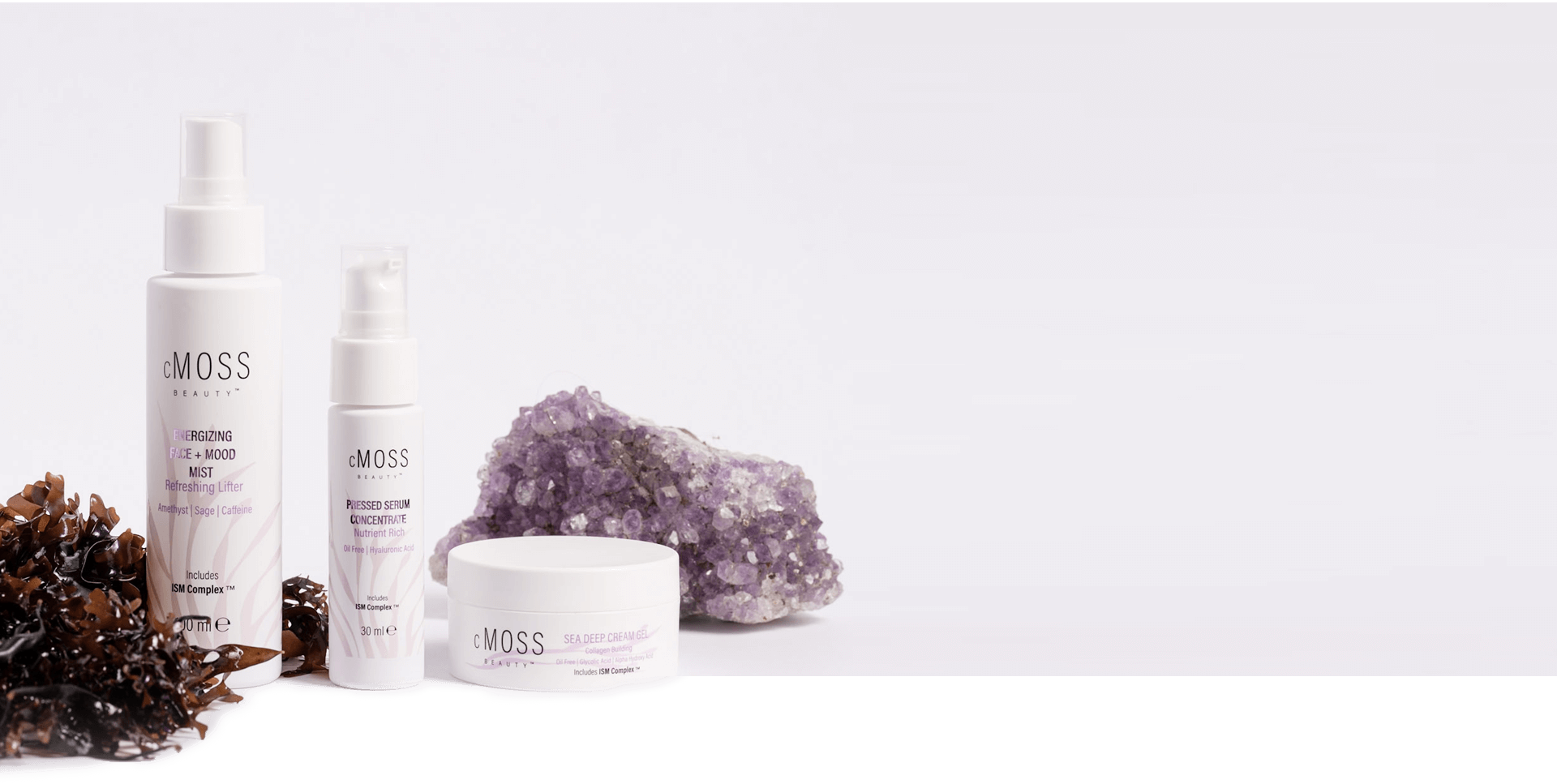 cmoss energizing face and mood mist, pressed serum concentrate and sea deep cream gel over bed of irish sea moss banner