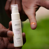 cmoss pressed serum concentrate on finger